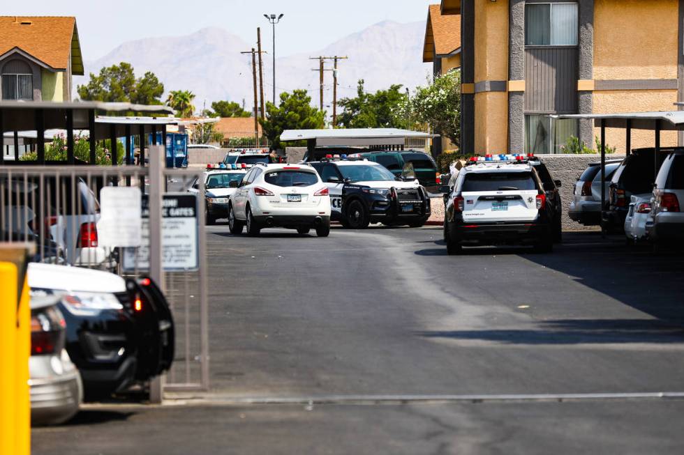 Police at the apartment complex where a shooting took place in the 1900 block of North Jones Bo ...