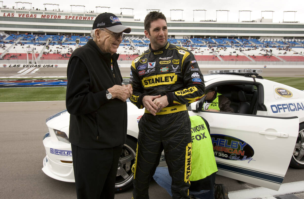 Carroll Shelby, founder of Las Vegas-based Shelby American Inc., poses with Elliott Sadler, a t ...