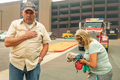 Jim, left, and Alicia Halloran with dog Billy Budd prepare to leave from the Montbleu Resort, C ...