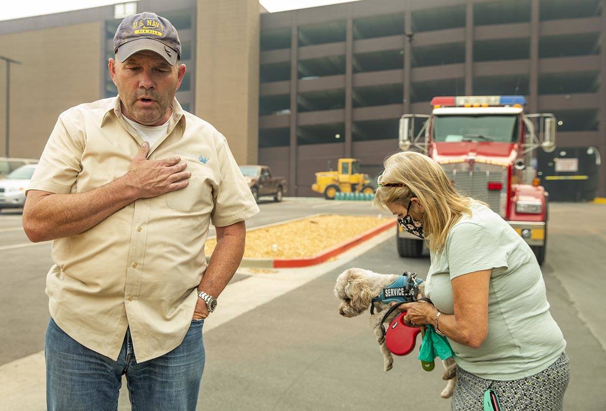 Jim, left, and Alicia Halloran with dog Billy Budd prepare to leave from the Montbleu Resort, C ...