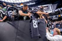 Raiders owner Mark Davis signs autographs for fans before the Raiders home opening preseason ga ...
