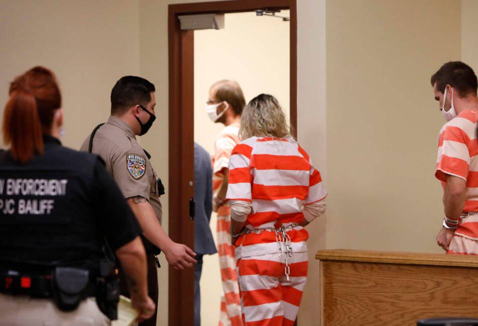 Brad Mehn, Heather Pate and Kevin Dent leave the courtroom after attending their court hearing ...