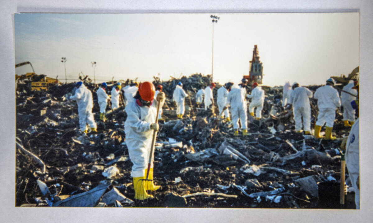An image taken by FBI Special Agent Tracy Dockery shows people while working to sort 9/11 debri ...