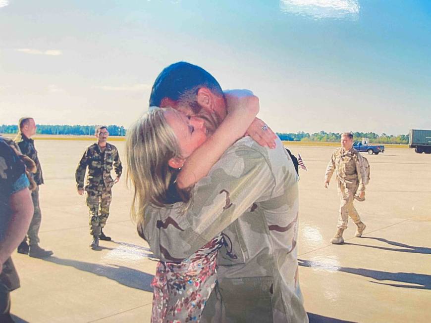 Henderson police Sgt. Jeb Bozarth is reunited with his wife after a 2004 deployment to Iraq (Je ...