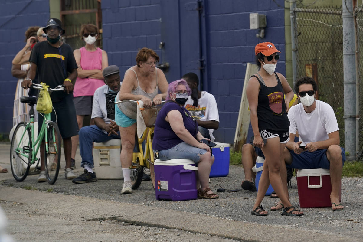 In the aftermath of Hurricane Ida people lining up for food and ice at a distribution center We ...