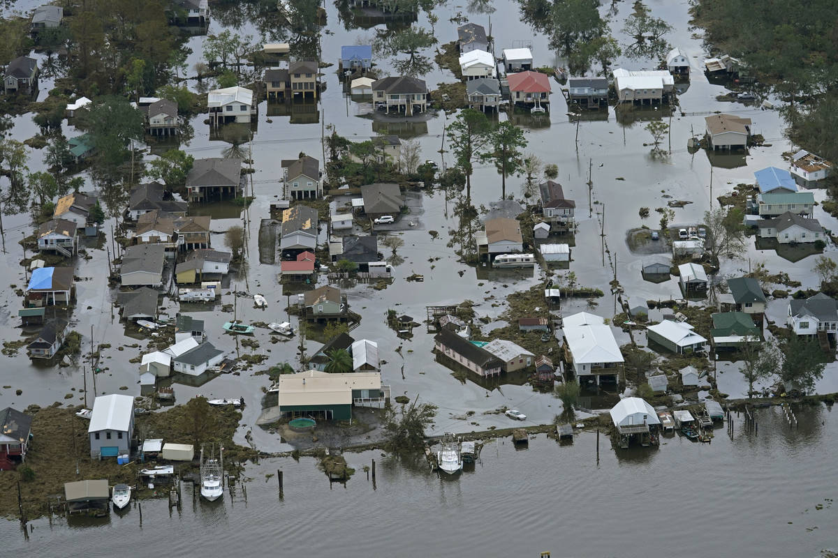 Floodwater slowly recedes in the aftermath of Hurricane Ida in Lafitte, La., Wednesday, Sept. 1 ...