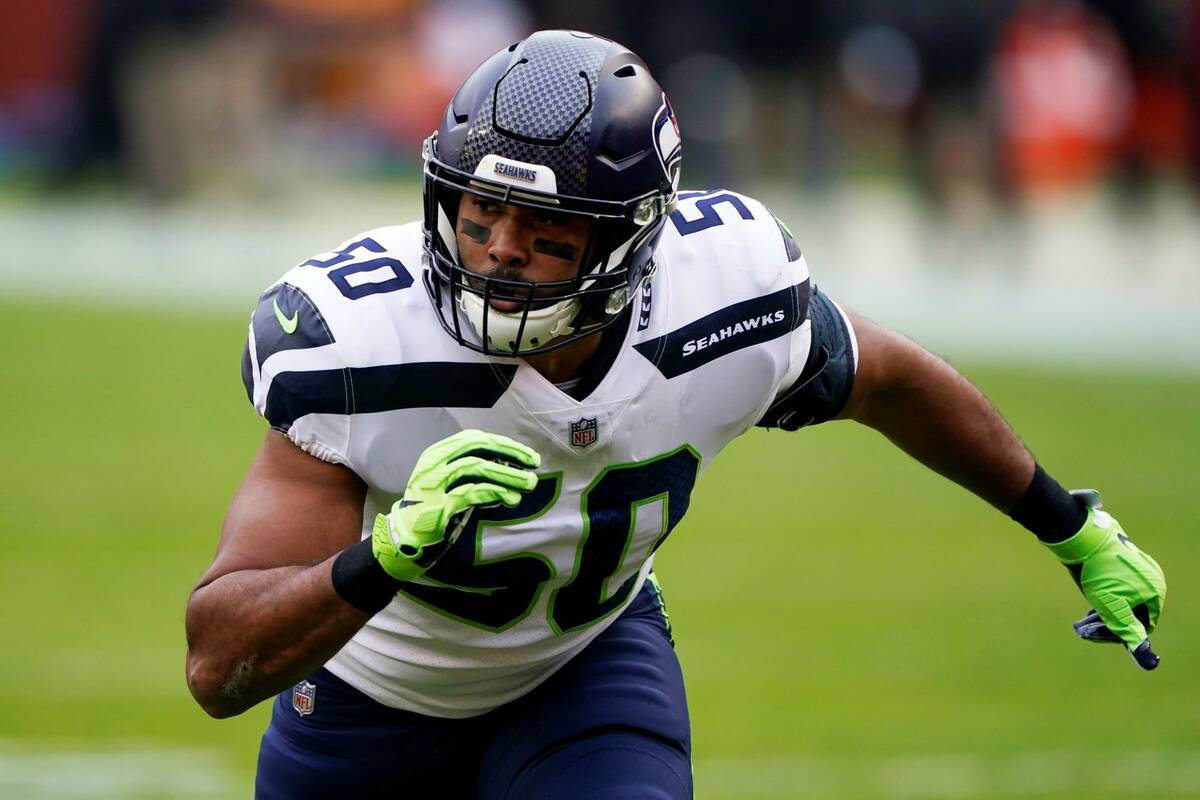 Seattle Seahawks outside linebacker K.J. Wright rushes during the team's game against the Washi ...