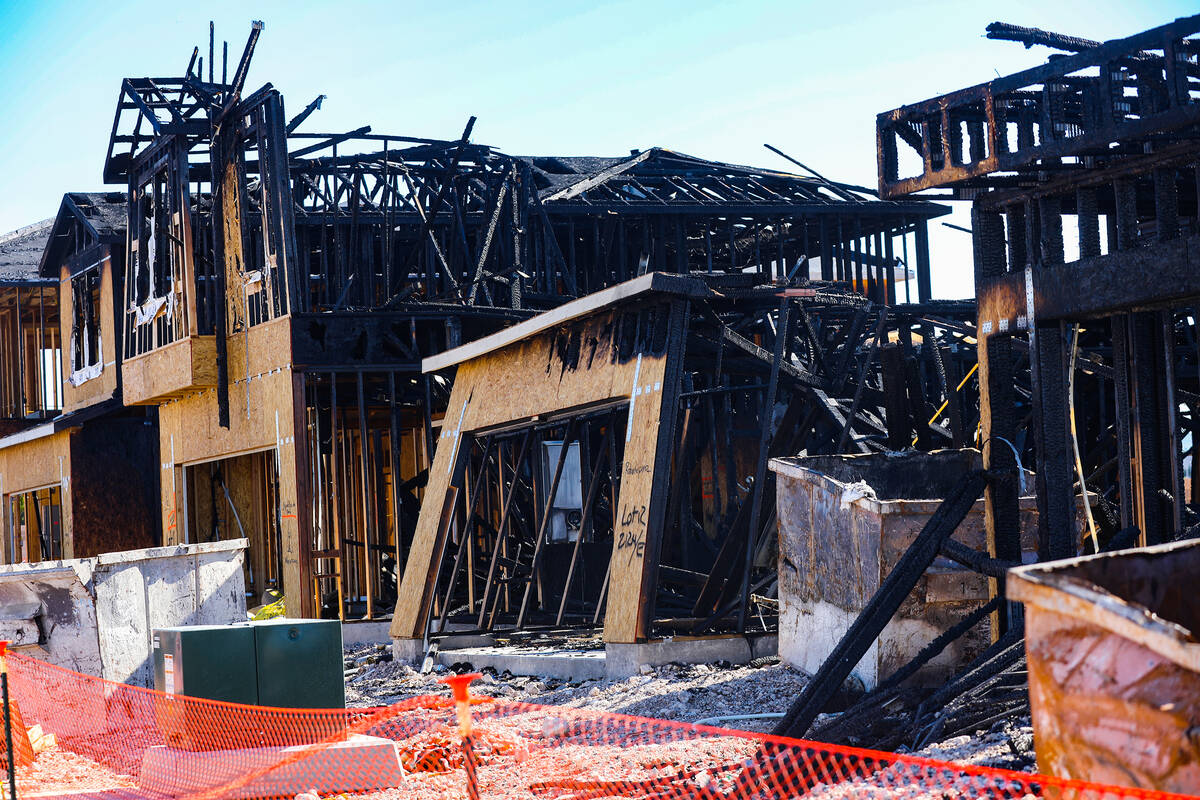 Remnants of a fire from last night at homes under construction by the company KB Home in southw ...