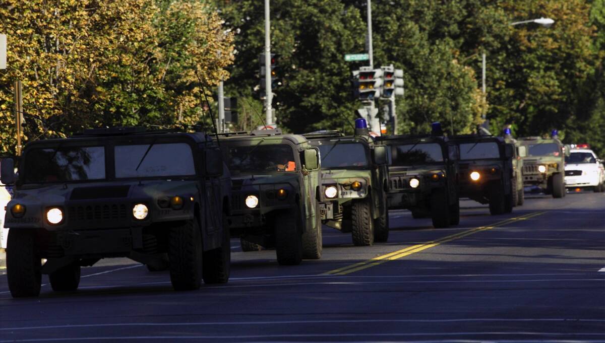A convoy of military police arrives in Washington near the U.S. Capitol on Sept. 11, 2001. Gove ...