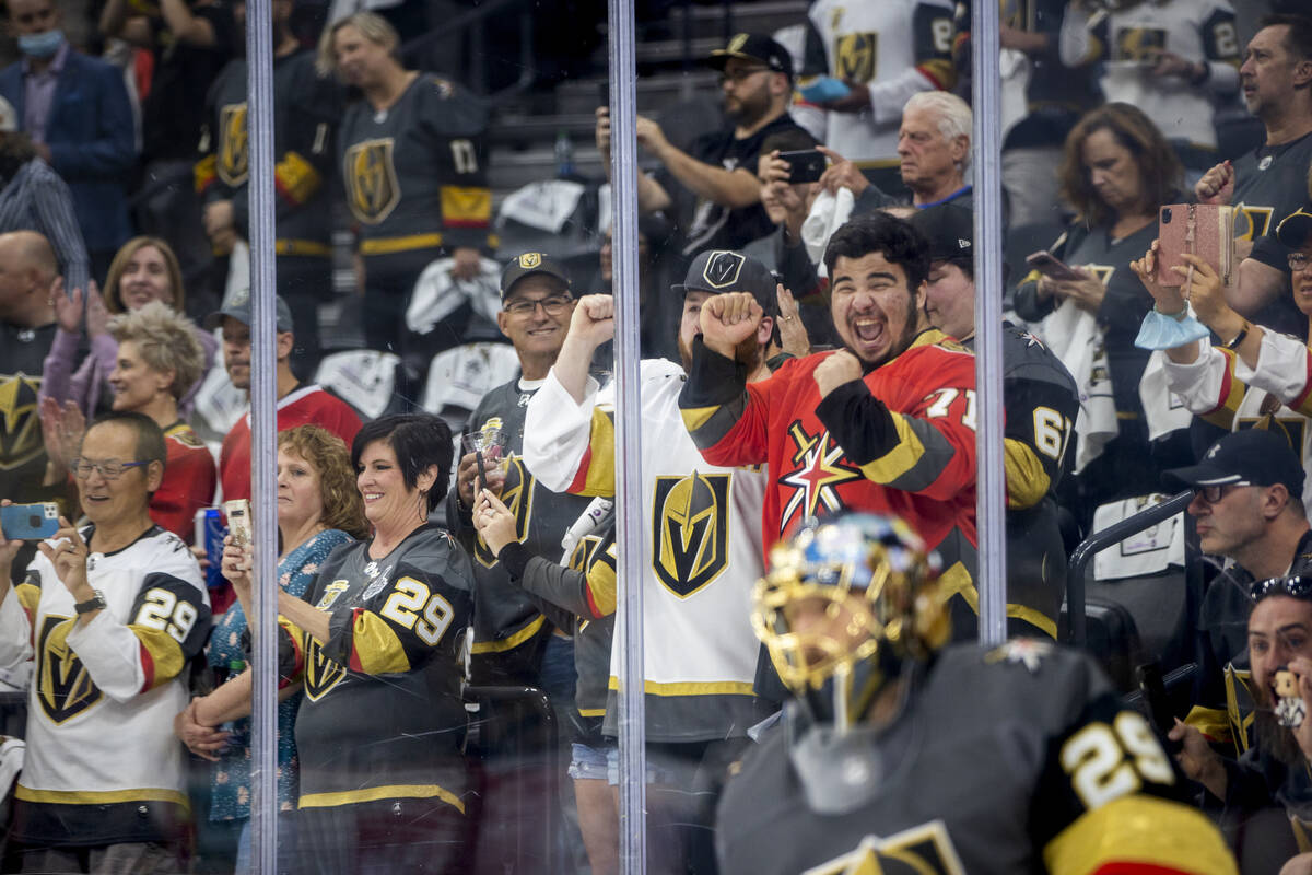 Golden Knights fans get pumped up as goaltender Marc-Andre Fleury (29) and teammates take the i ...