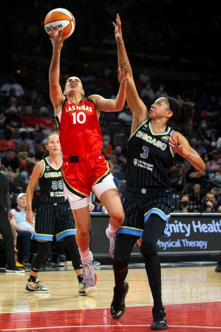 Las Vegas Aces guard Kelsey Plum (10) goes up for a layup as Chicago Sky forward/center Candace ...