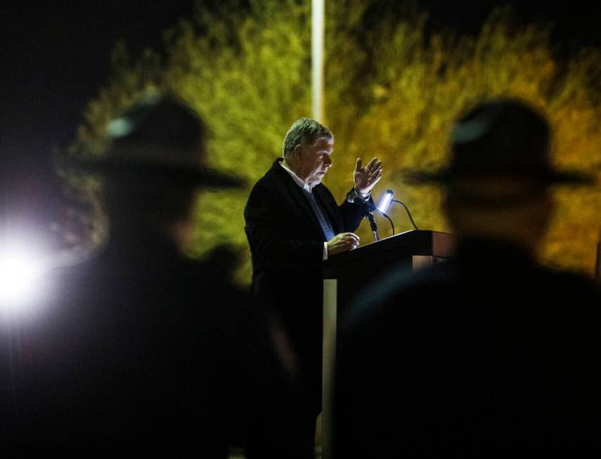 Gary Wadell provides the opening words during a candlelight vigil for victims of traffic accide ...