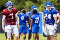 Kentucky quarterback Will Levis (7) and running back Chris Rodriguez Jr. (24) wait for a drill ...
