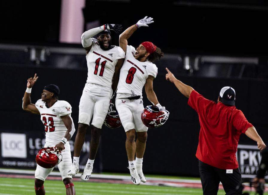 Eastern Washington University wide receivers Freddie Roberson (11) and Johnny Edwards IV (8) ce ...