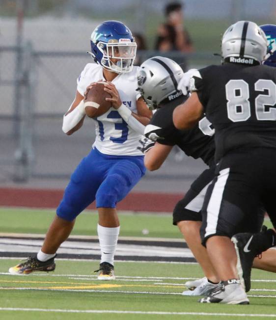 Green Valley High School's Josiah Vitale (13) looks to throw the ball against Palo Verde High S ...