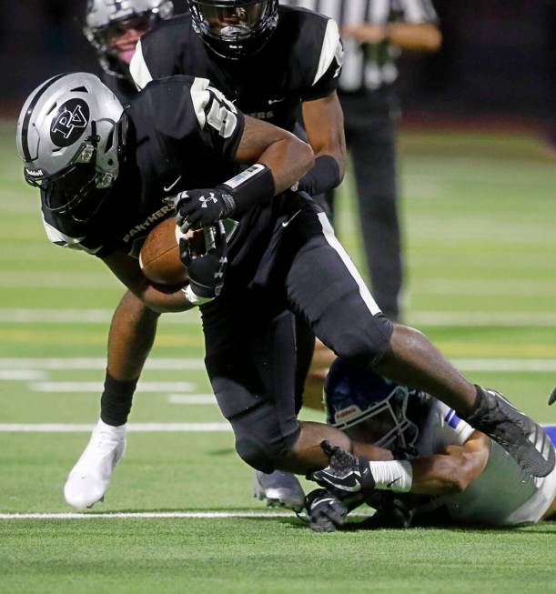 Green Valley High School's Logan Squires (55) tries to stop Palo Verde High School's Daquahn Go ...