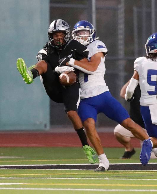 Palo Verde High School's Dapari Chandler, left, fails to make the catch against Green Valley Hi ...