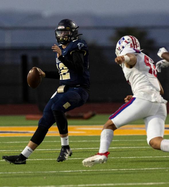 Foothill HighÕs quarterback Cameron Paul (12) prepares to throw a pass as Liberty High&#xd ...