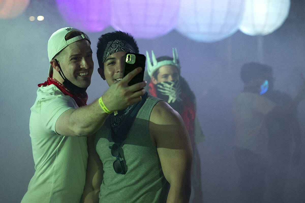 Jake Updegrove, left, and Mikel Delion, of Los Angeles, Calif., take a photo during the Lost in ...
