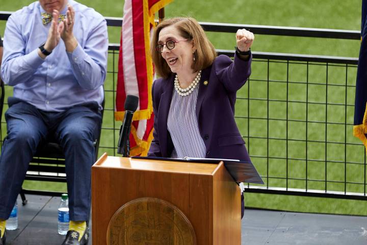 FILE - In this Wednesday, June 30, 2021, file photo, Oregon Gov. Kate Brown pumps her fist whil ...