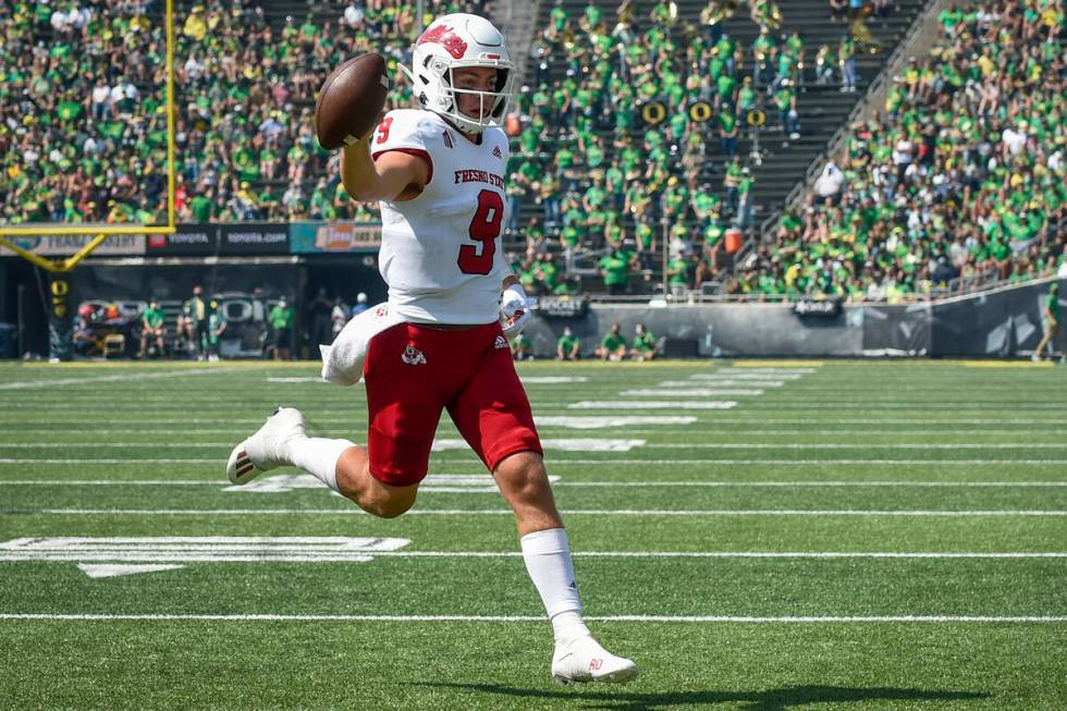 Fresno State quarterback Jake Haener (9) scores during the third quarter of an NCAA college foo ...