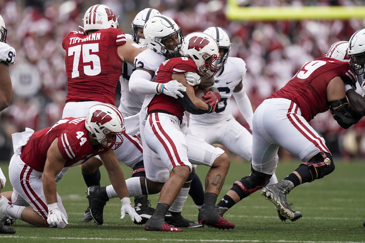 Penn State linebacker Ellis Brooks tackles Wisconsin running back Chez Mellusi (6) during the f ...