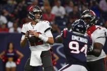 Tampa Bay Buccaneers quarterback Tom Brady (12) looks to pass against the Houston Texans during ...