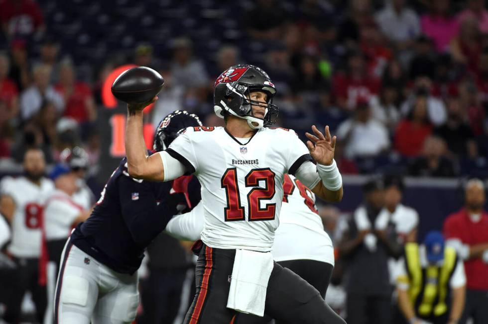 Tampa Bay Buccaneers quarterback Tom Brady (12) throws a pass against the Houston Texans during ...