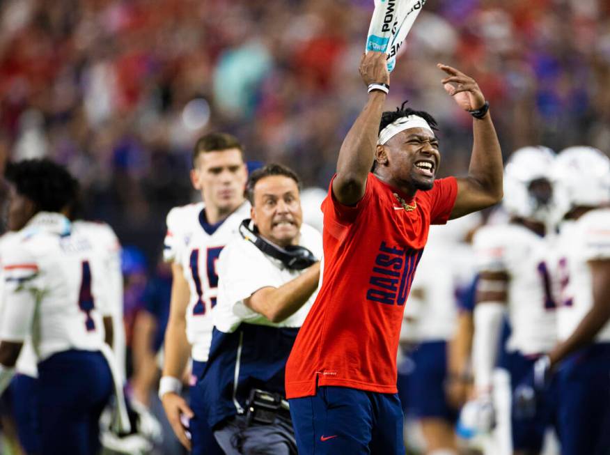 Arizona Wildcats players try and fire up their team in the fourth quarter during a college foot ...