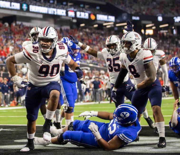 Arizona Wildcats defensive lineman Trevon Mason (90) celebrates a safety in the fourth quarter ...