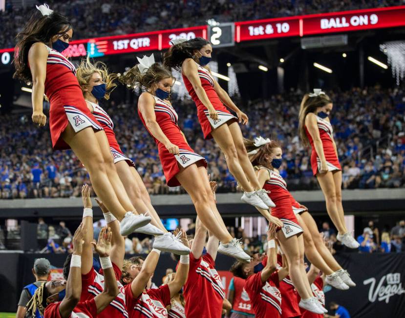 Arizona Wildcat cheerleaders perform in the first quarter during a college football game agains ...