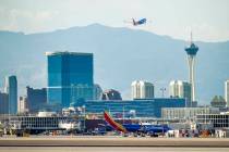 A Southwest plane departs as heat is causing travel delays at McCarran International Airport on ...