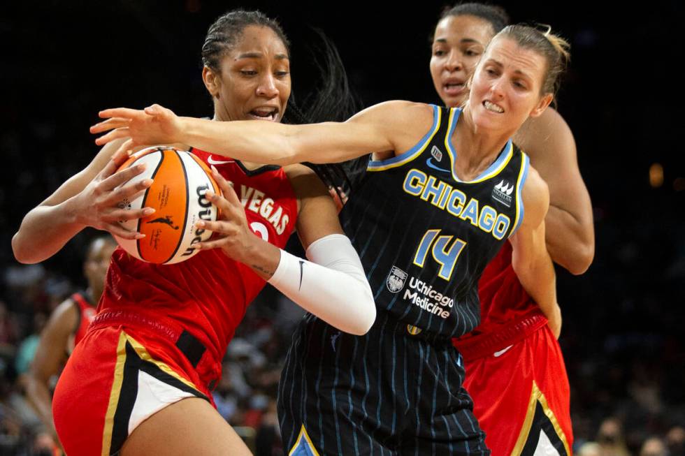 Las Vegas Aces forward A'ja Wilson (22) fights for control of the ball with Chicago Sky guard A ...