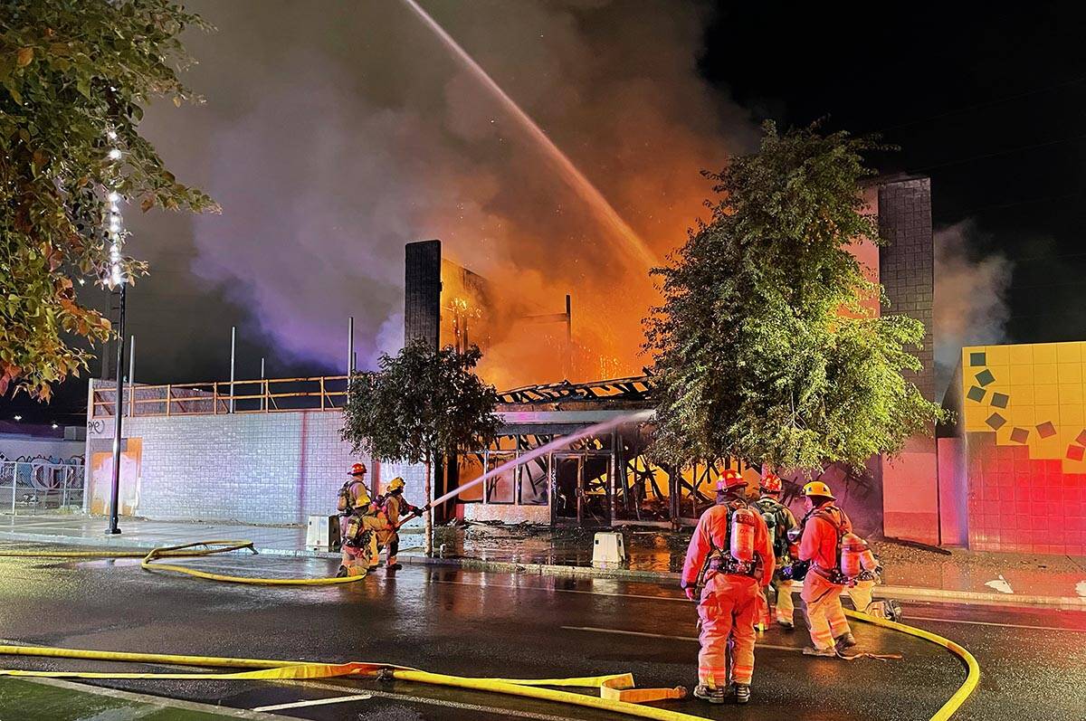 Firefighters extinguish a building fire on Commerce Street in downtown Las Vegas on Sunday, Sep ...