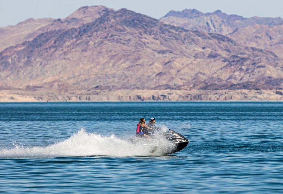 People jet ski at Lake Mead on Labor Day on Monday, Sept. 6, 2021, nere Boulder City. (Benjamin ...