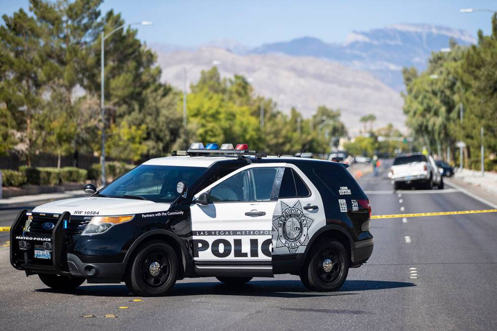 Law enforcement investigates a fatal car crash near North Tenaya Way and Farm Road on Monday, S ...