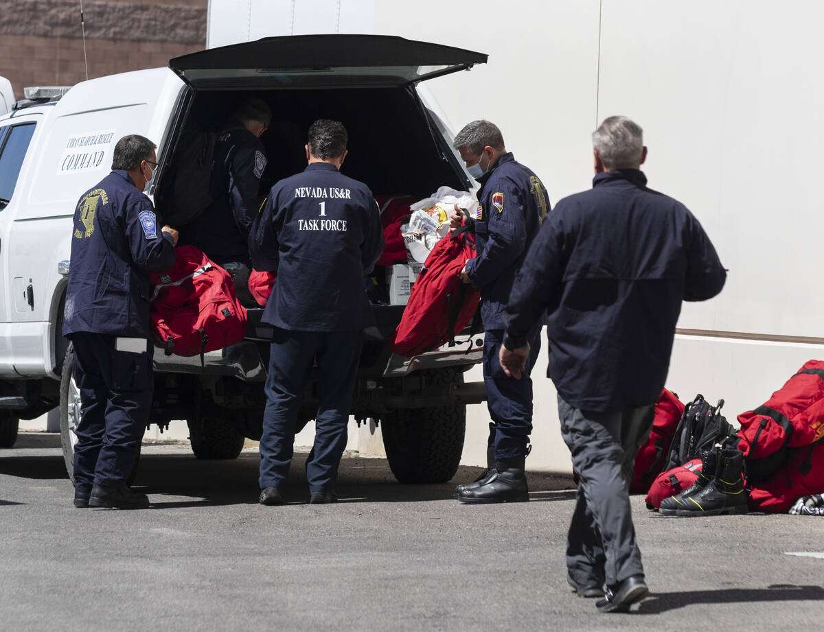 Members of the Nevada Task Force 1 unload their equipments after arriving at Nevada Task Force ...