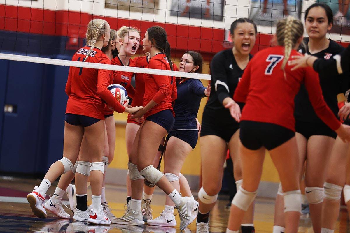 Coronado players react after a play against Liberty in a girls volleyball game at Coronado High ...