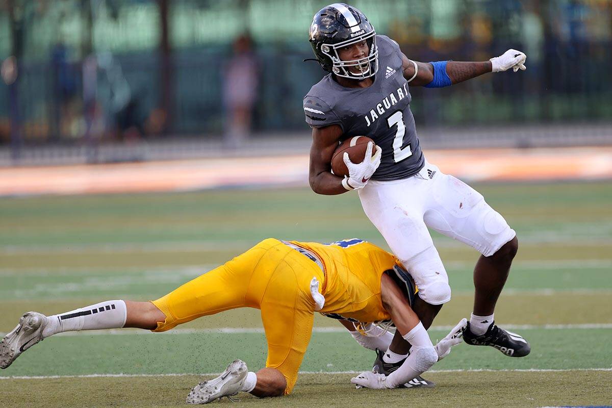 Orem's Jaxon Beckstrom (8) tackles Desert Pines' Javontae Barnes (2) in the third quarter of a ...