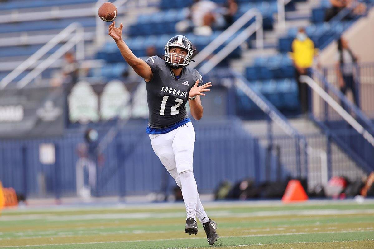 Desert Pines' Rjay Tagataese (12) throws a pass in the second quarter of a football game agains ...