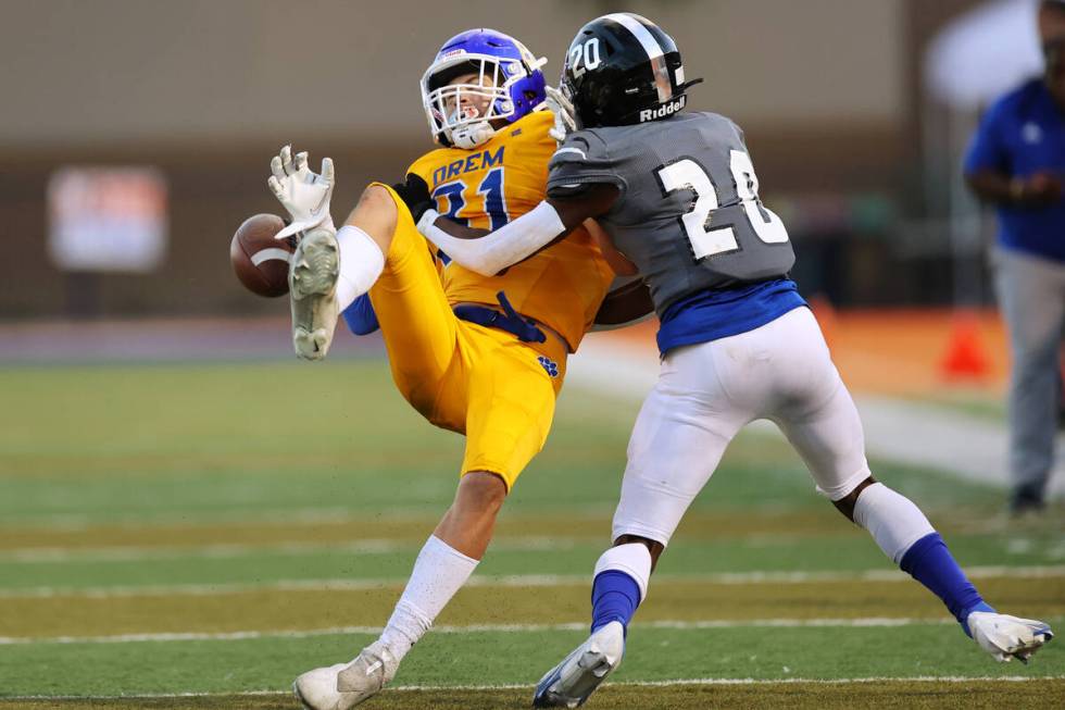 Desert Pines' Isaiah Rubin (20) tackles Orem's Asher Young (81) in the fourth quarter of a foot ...