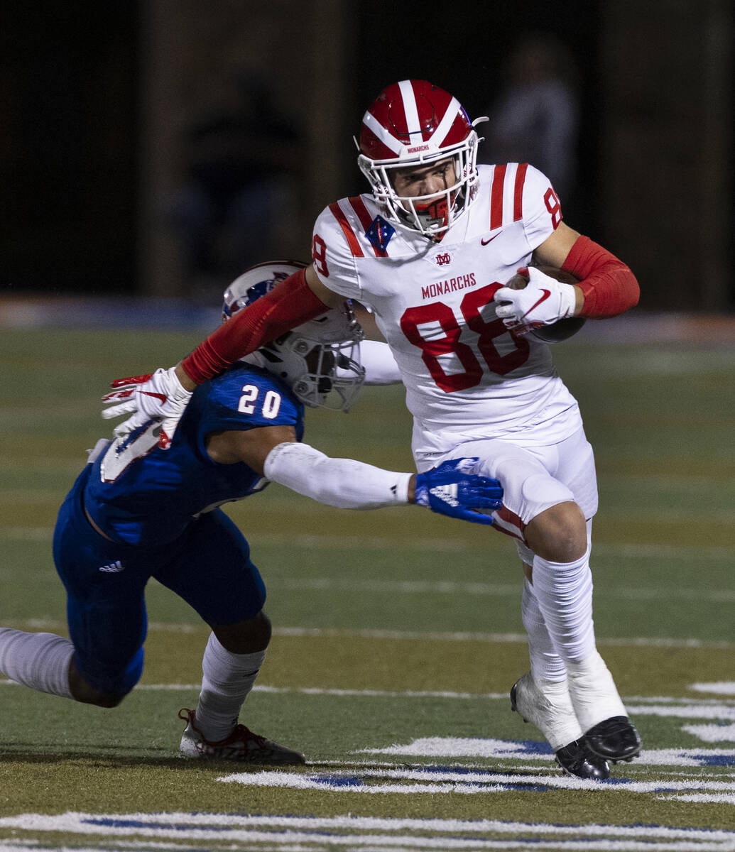 Liberty High safety Saco Alofipo (20) tries to take down Mater Dei High wide receiver Jack Ress ...