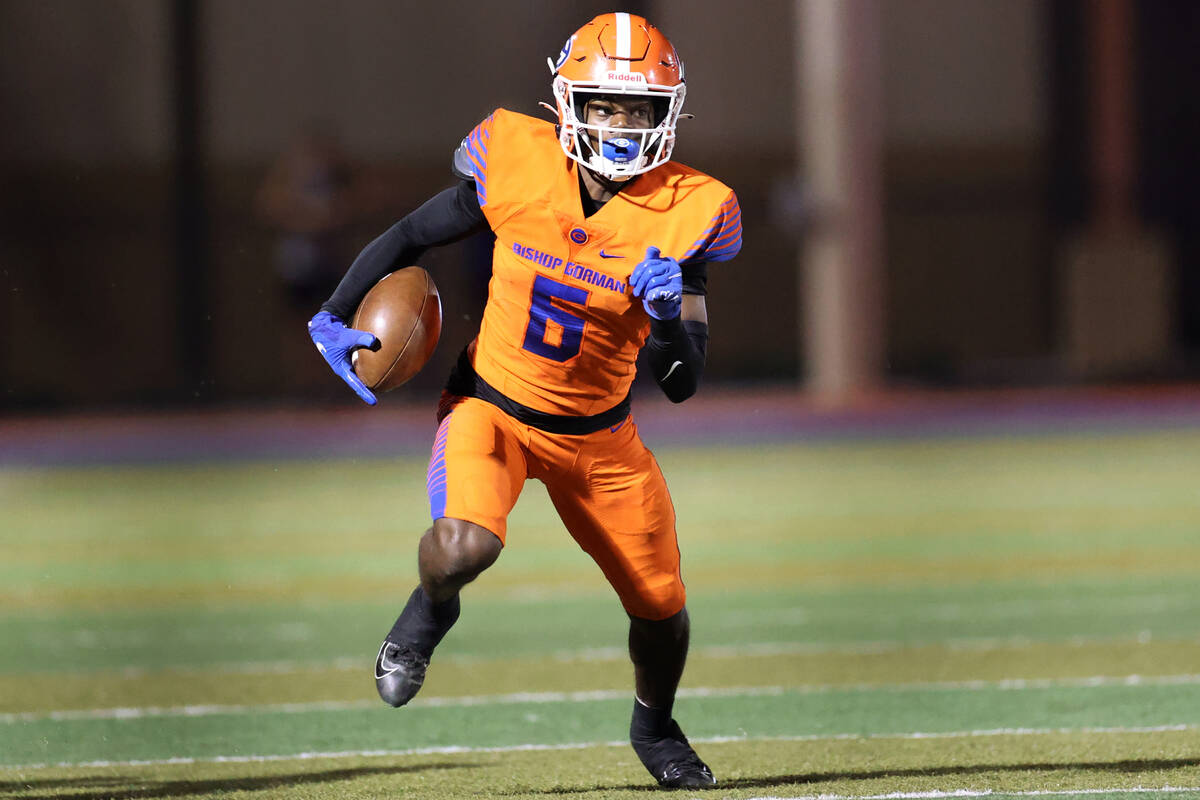 Bishop Gorman's Jonathan Brady (6) runs the ball in the second quarter of a football game again ...