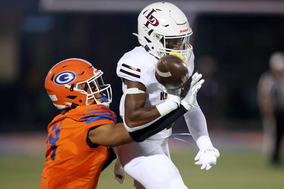 Bishop Gorman's Fabian Ross (4) interferes with a pass intended for Lone Peak's Luke Hyde (2) i ...