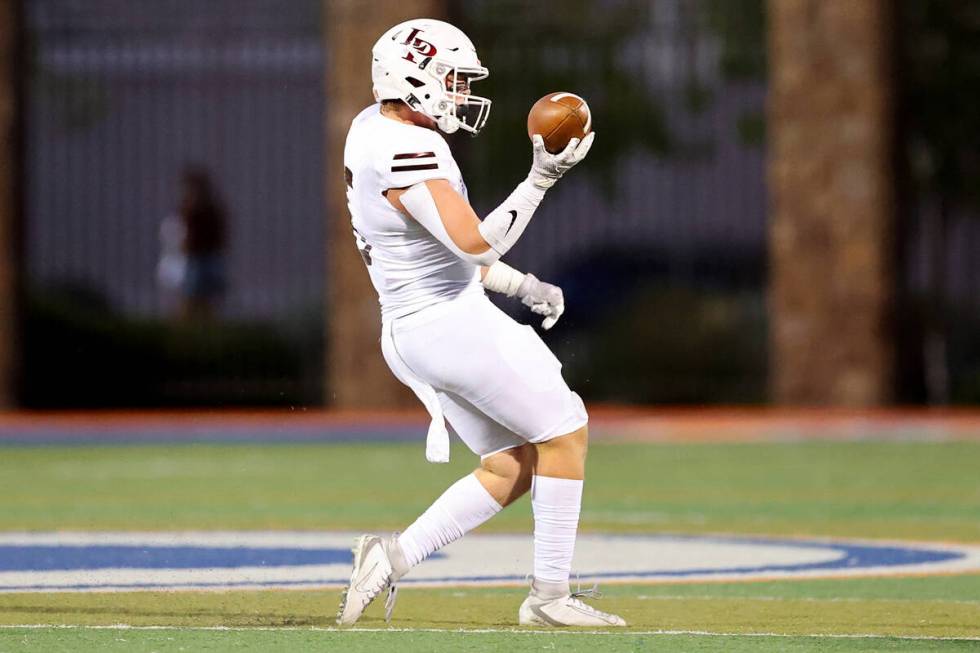 Lone Peak's Luke Durfey (5) holds a recovered fumble by Bishop Gorman in the first quarter of a ...