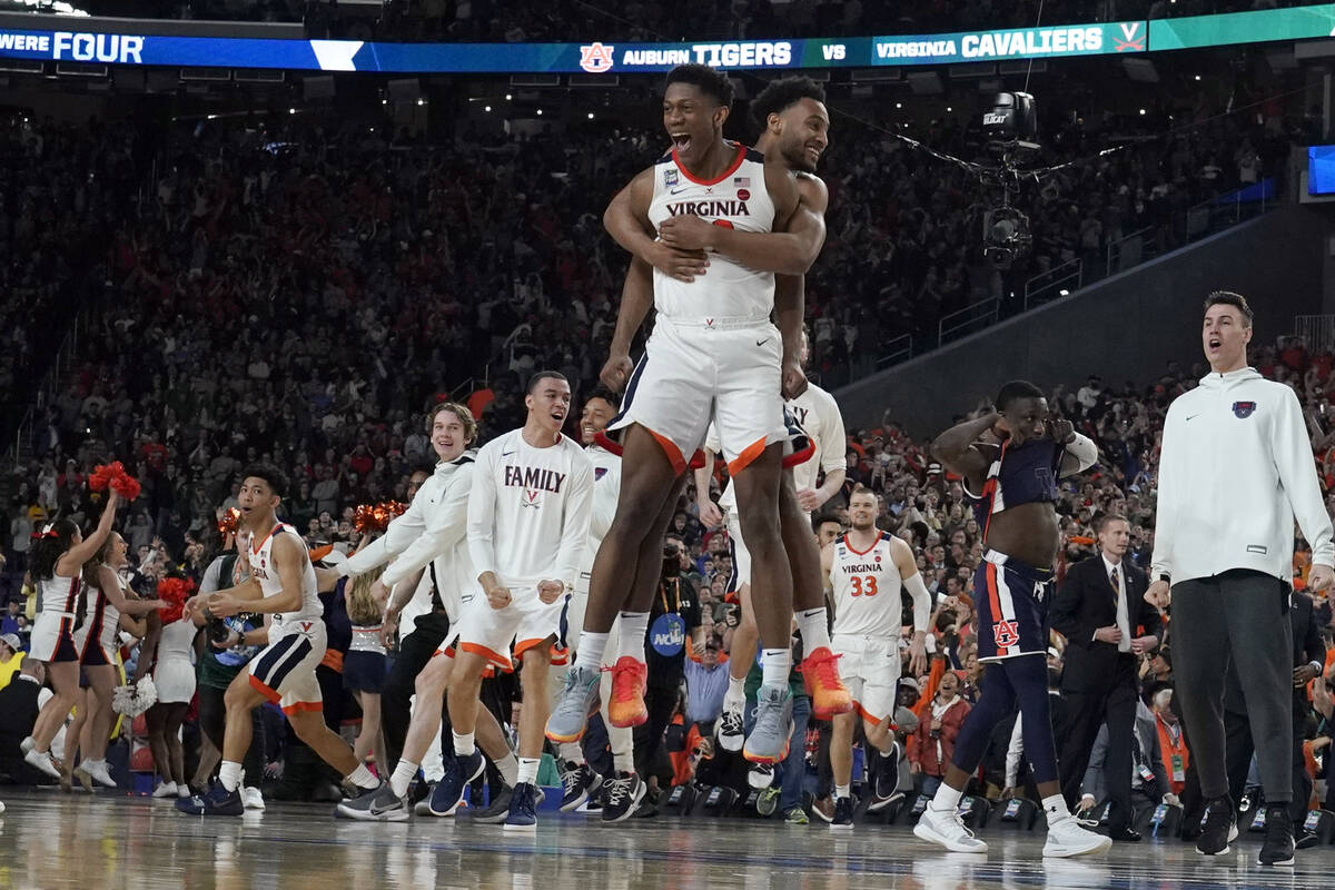 Virginia players celebrate after defeating Auburn 63-62 in the semifinals of the Final Four NCA ...