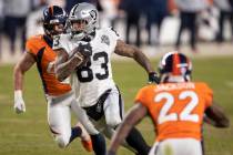 Raiders tight end Darren Waller (83) makes a big run and catch past Denver Broncos inside lineb ...