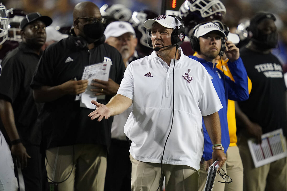 Texas A&M head coach Jimbo Fisher argues a call with a referee during the first half of an ...