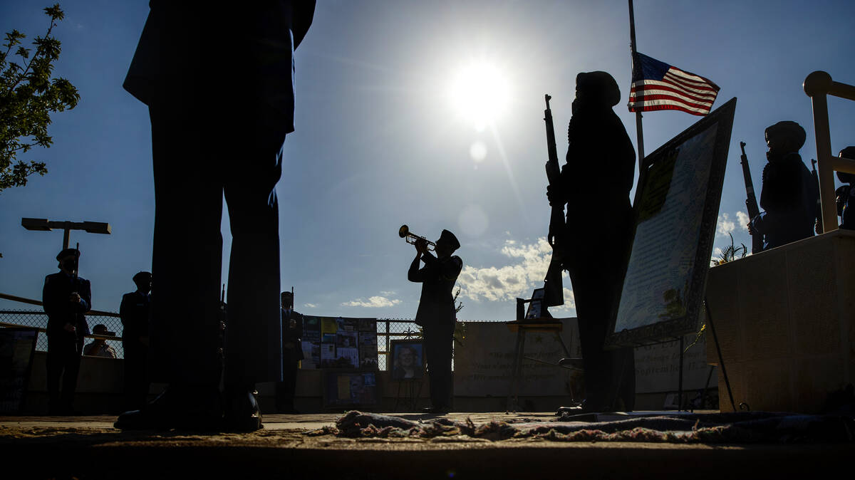 Taps is played by an Air Force JROTC cadet during a ceremony to honor the memory of Palo Verde ...