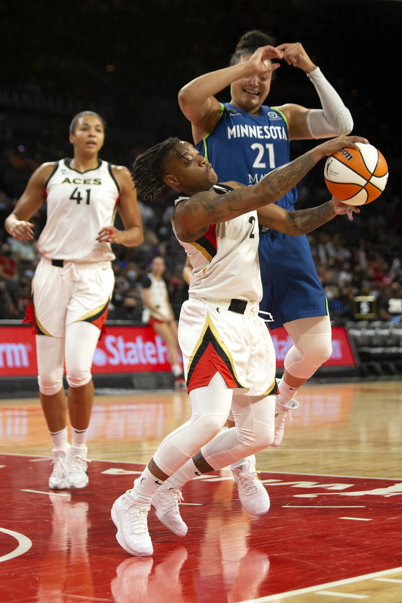 Las Vegas Aces guard Riquna Williams (2) gains control of the ball from Minnesota Lynx guard Ka ...